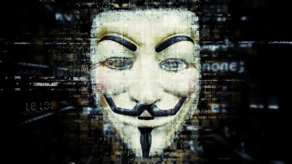 A Guy Fawkes mask overlaid with layers of digital computer code on a dark background.