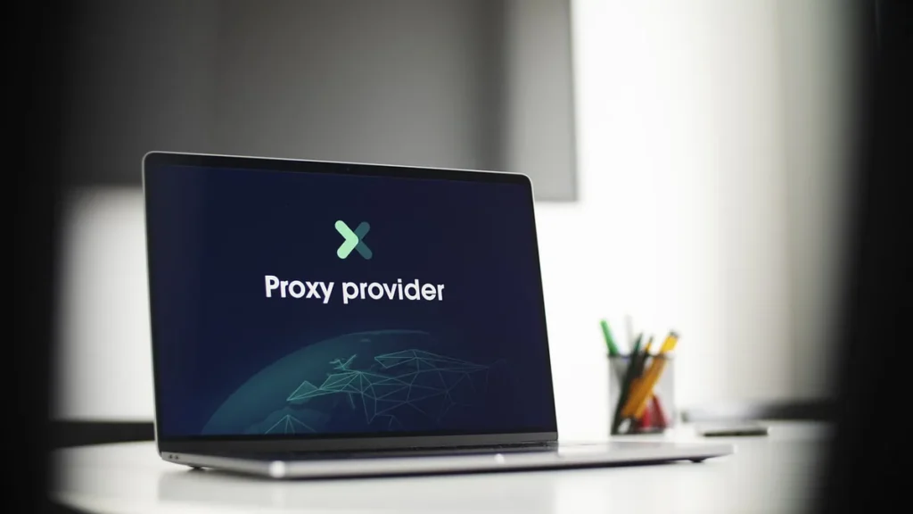 A laptop on a desk displays a screen with the text 'Proxy provider' and a stylized network globe graphic.