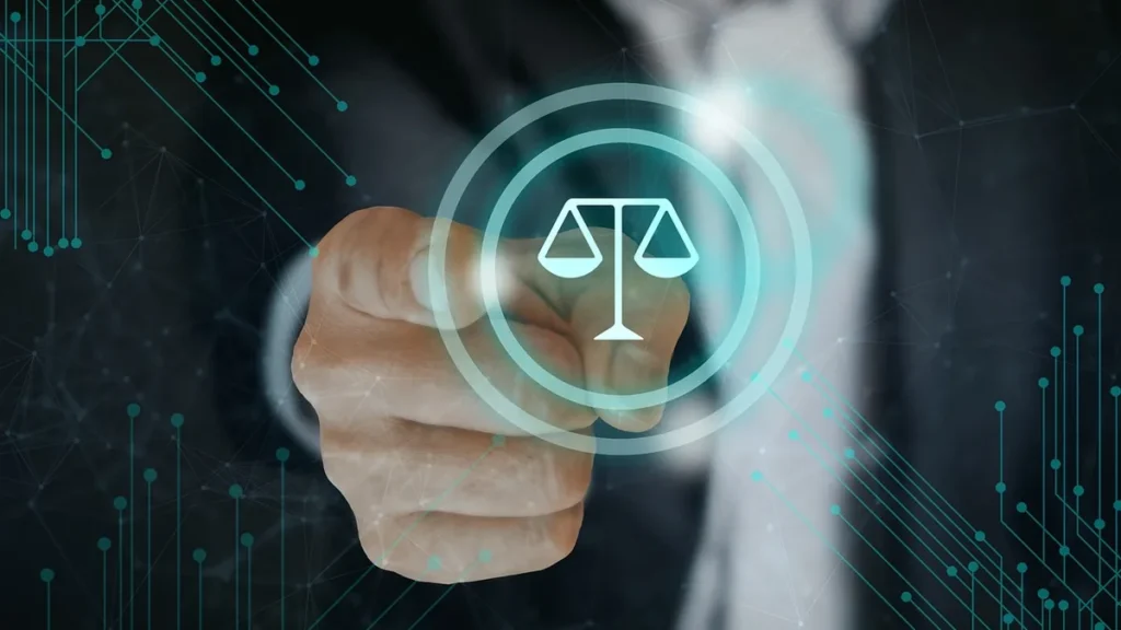 A hand points to a glowing teal scales of justice icon on a dark digital grid background.