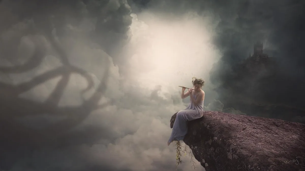 A woman in a flowing dress plays a flute while sitting on a cliff edge amidst cloudy skies.