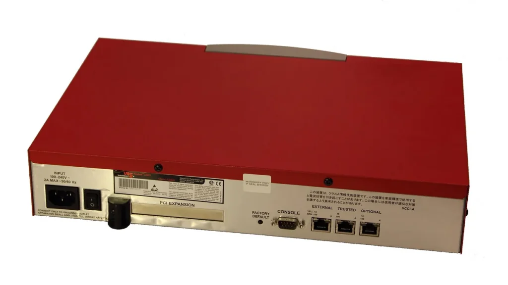 Rear view of a red WatchGuard Firebox 1000 firewall appliance showing ports and labels.