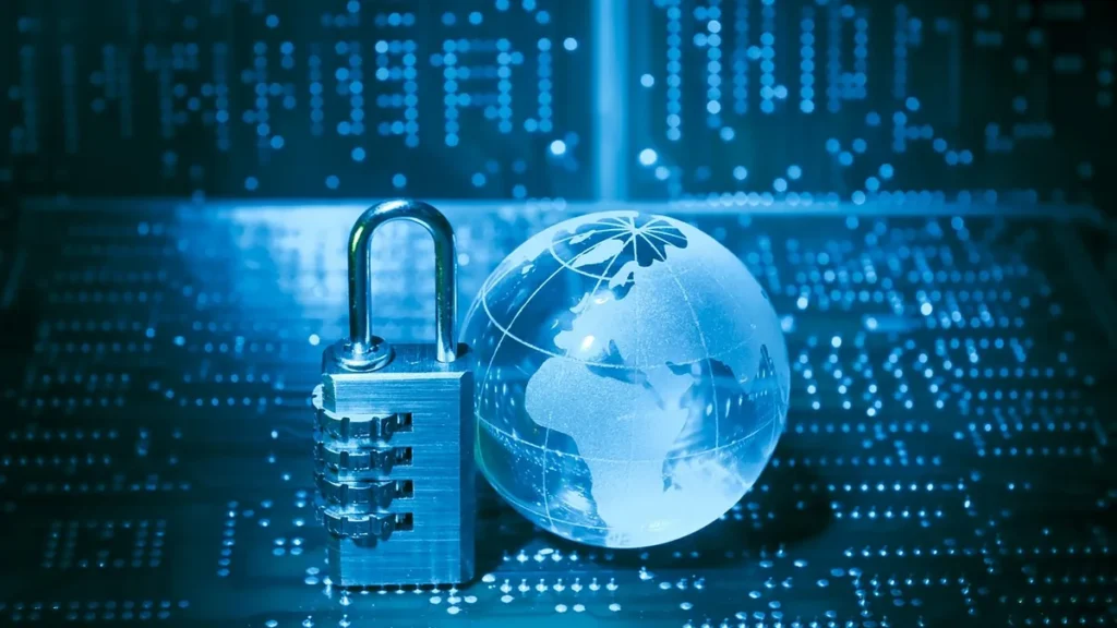 A combination padlock and glass globe on a blue circuit board, symbolizing global cybersecurity.