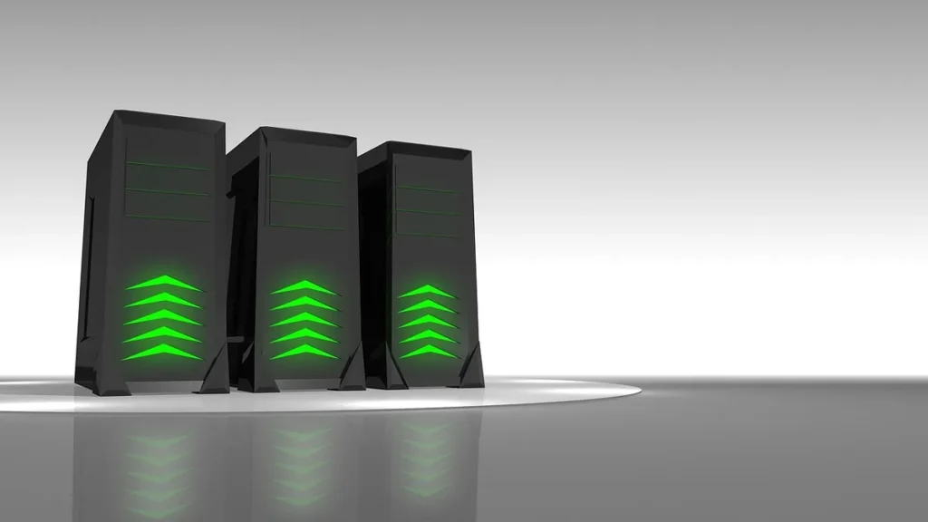 Three black server towers with glowing green chevron lights reflecting on a glossy surface.