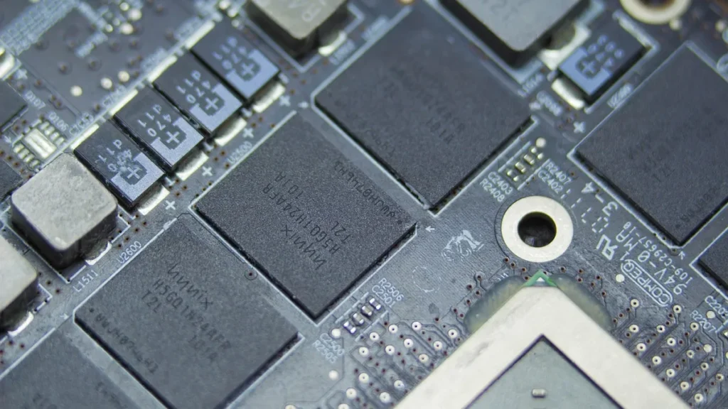 Macro photograph of Hynix microchips on a detailed black printed circuit board.