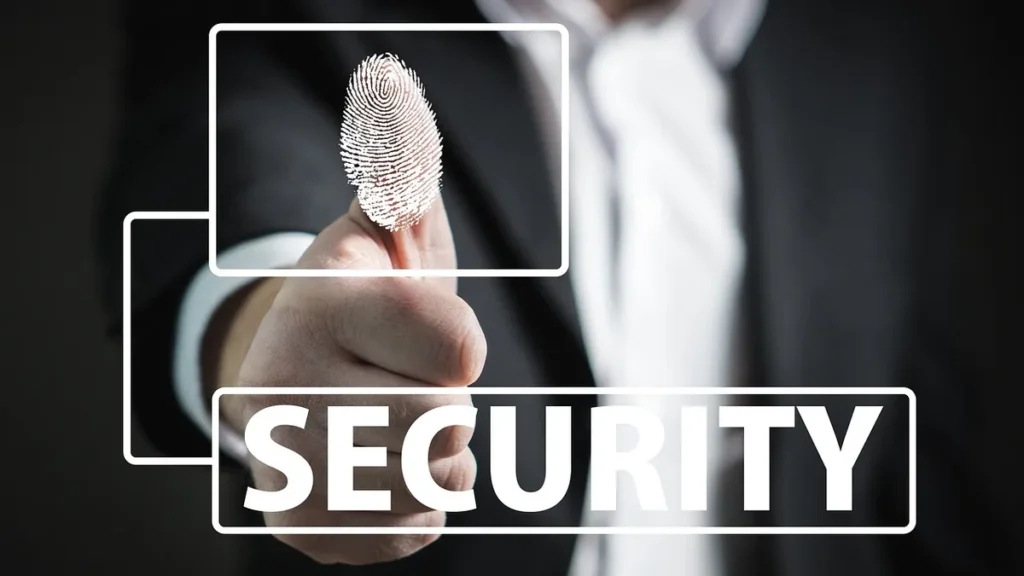 A finger with a glowing white fingerprint graphic over the word SECURITY in a white box.