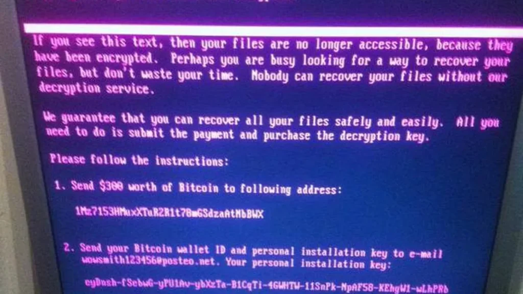 Ransomware screen displaying a purple text message demanding a Bitcoin payment for decryption.