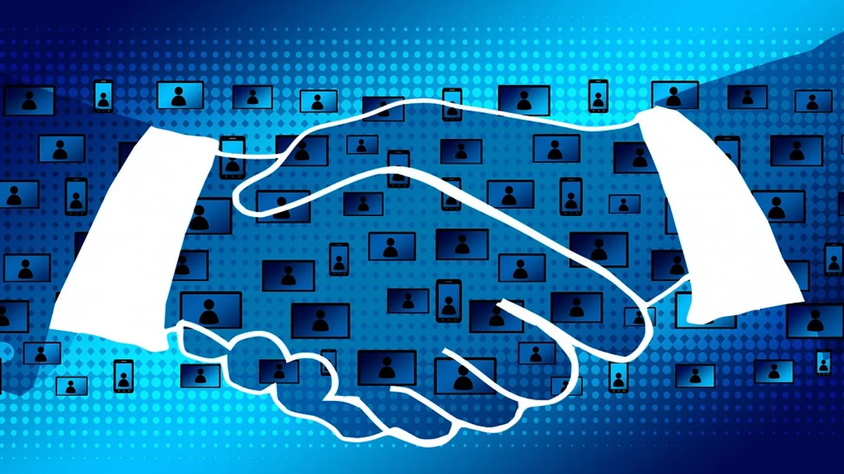 White outline of a handshake filled with user icons on a blue digital grid background.