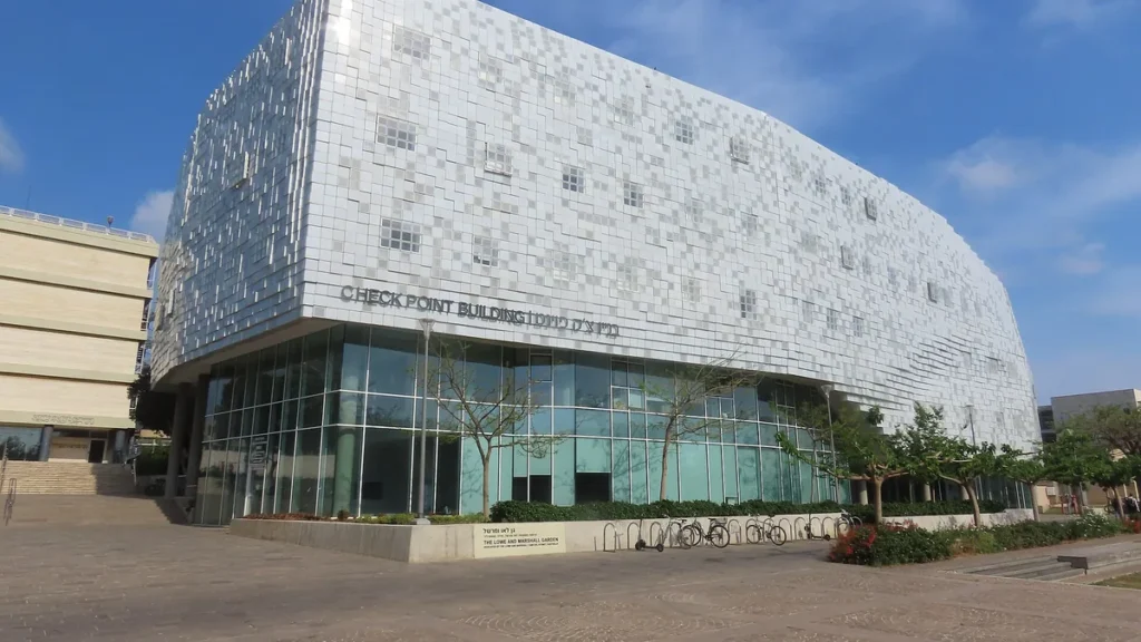 Exterior view of the Check Point Building featuring a reflective glass facade and prominent signage under a clear blue sky.